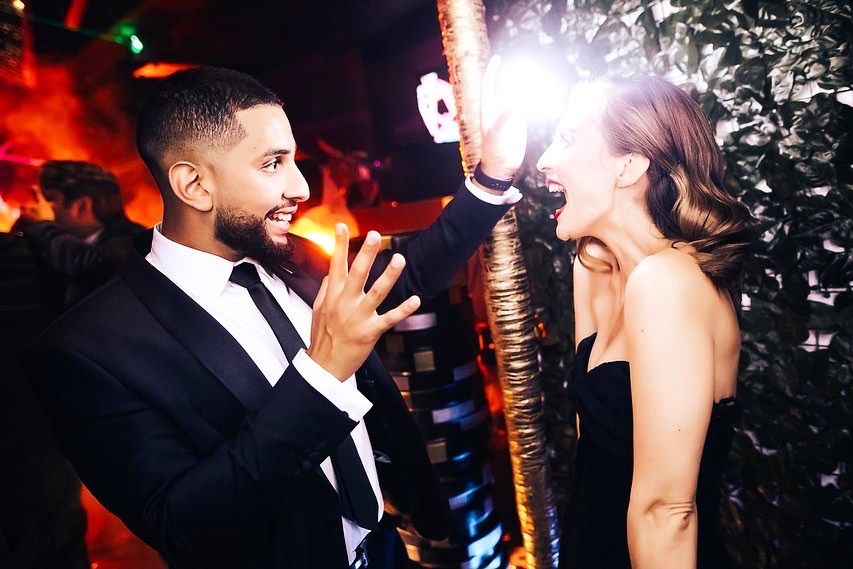 Close-up magic with VIP guests at a corporate event